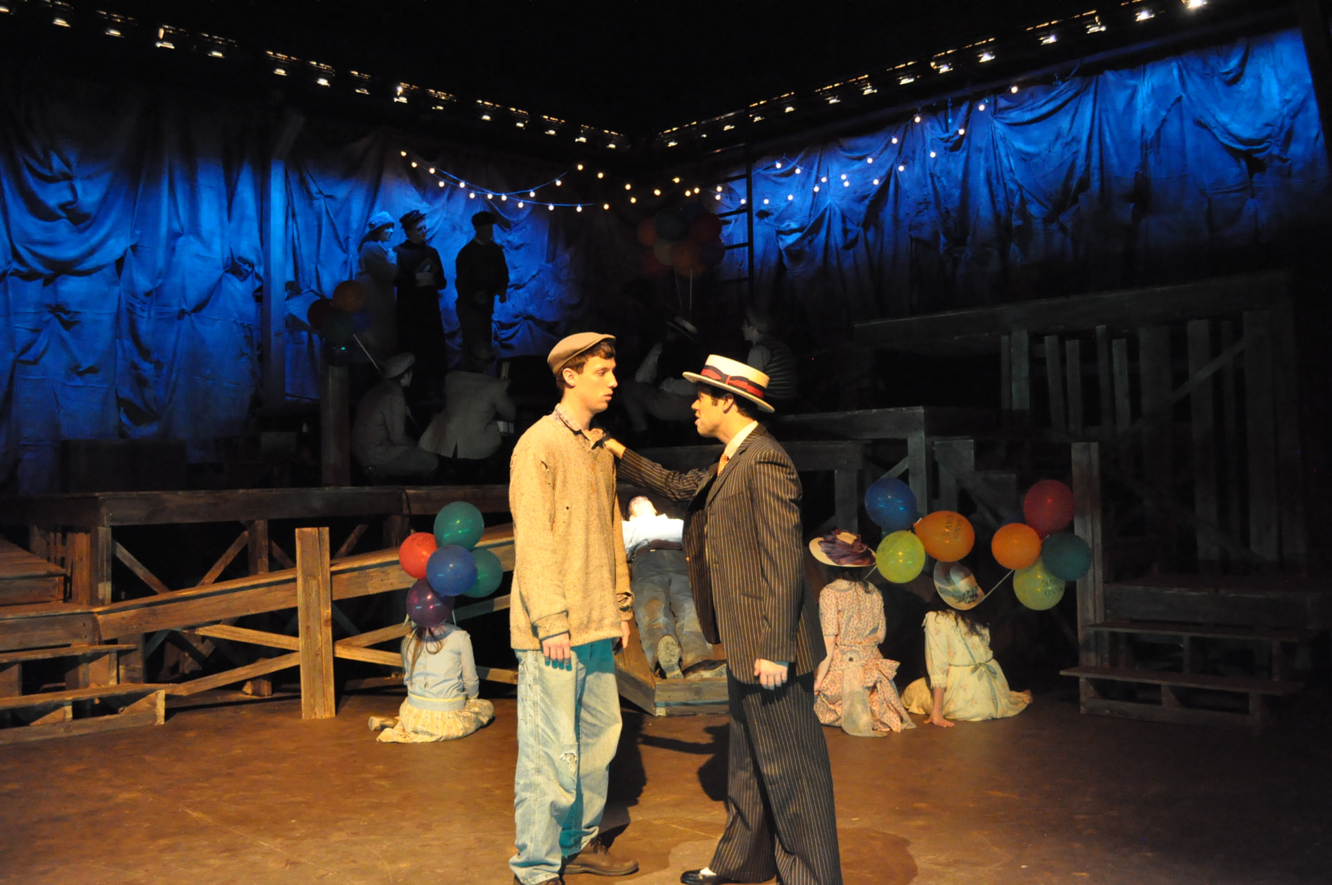 Floyd Collins — the carnival scene with balloons and the company in blue wash