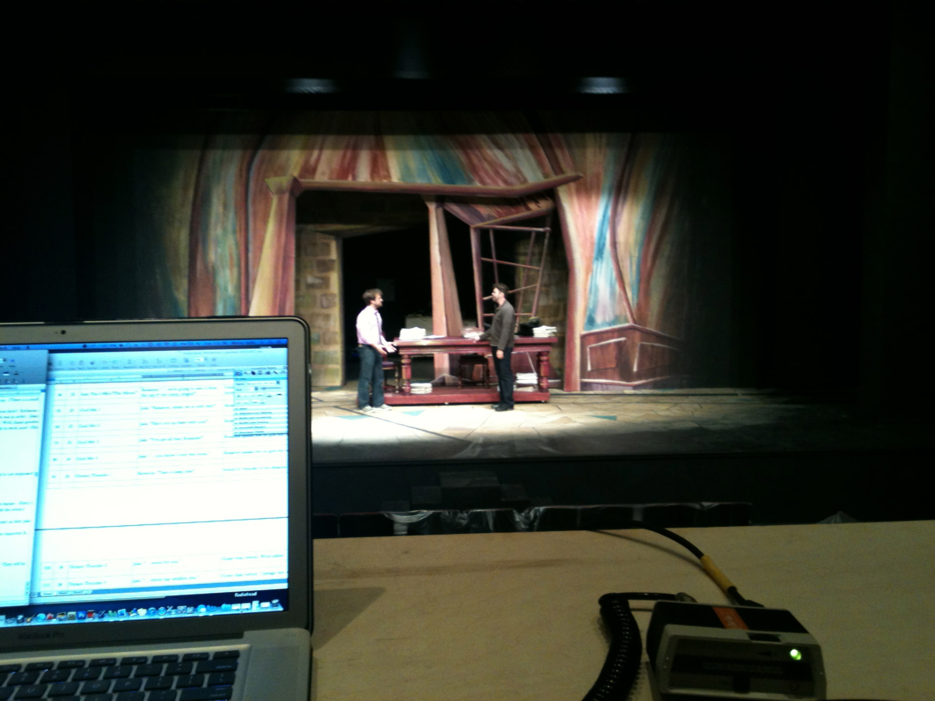 The Understudy — QLab cue list at the production desk with the scene running onstage