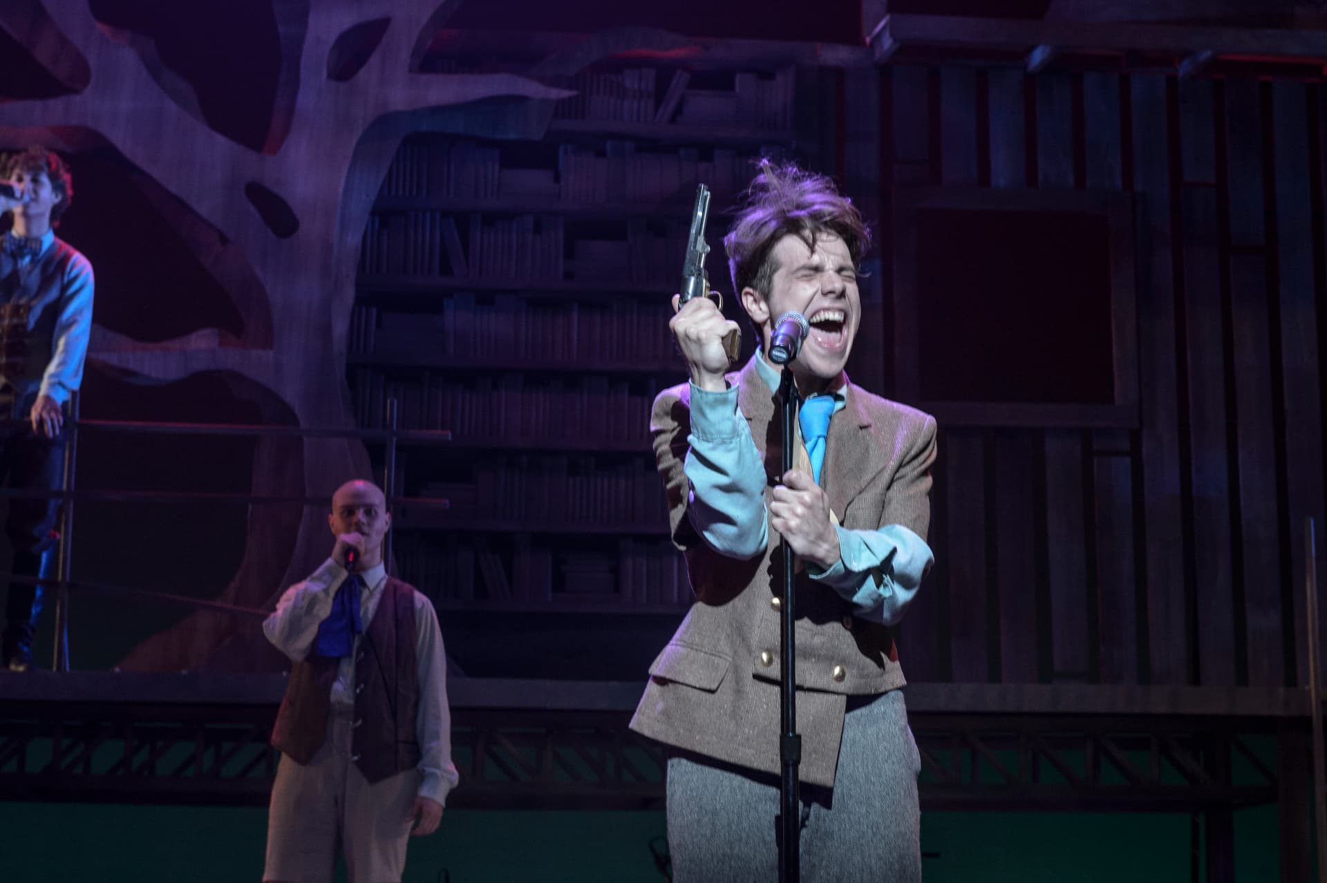 Spring Awakening — Moritz at the mic with pistol raised