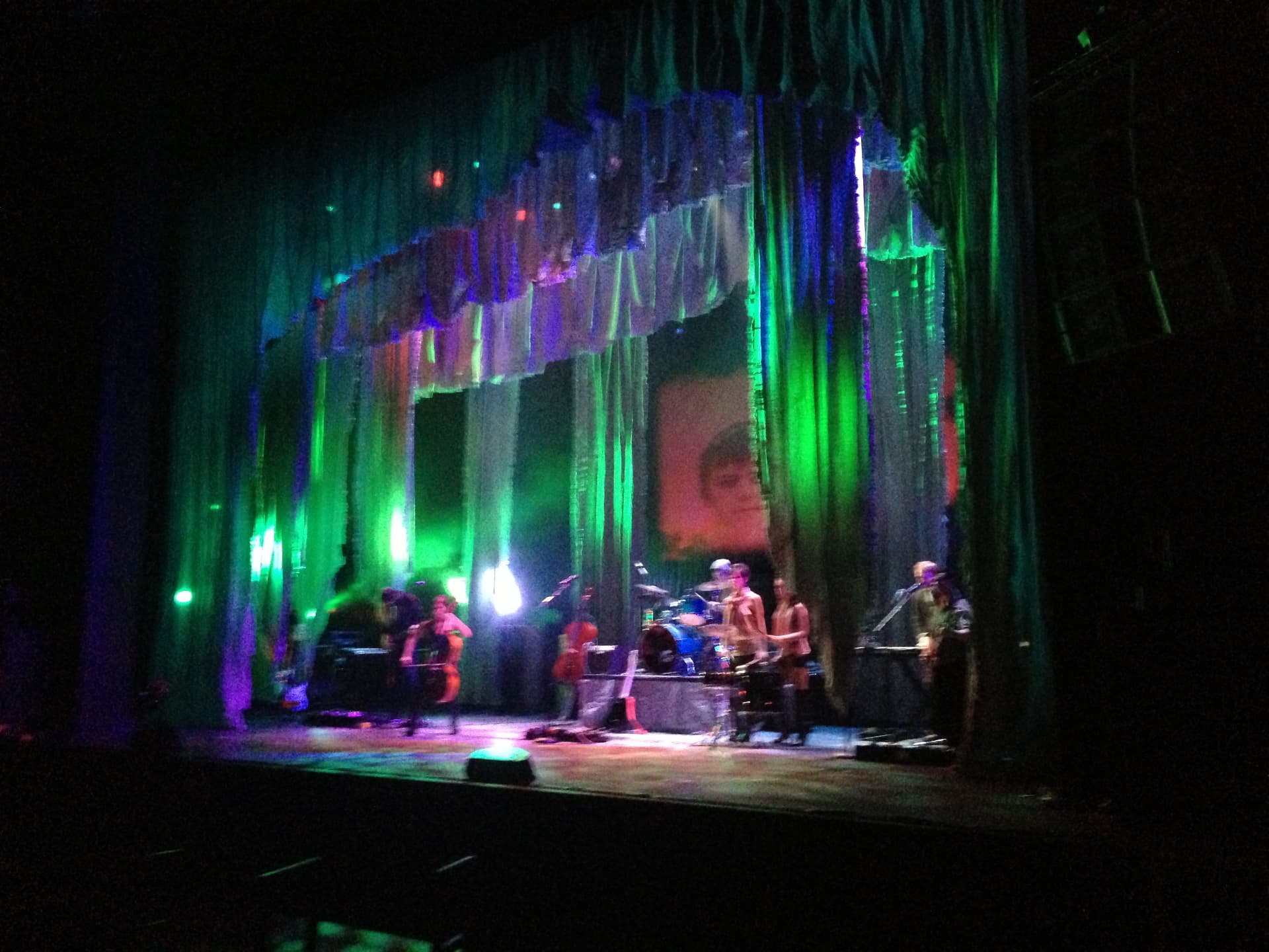 Medea — full band onstage under green and blue lighting