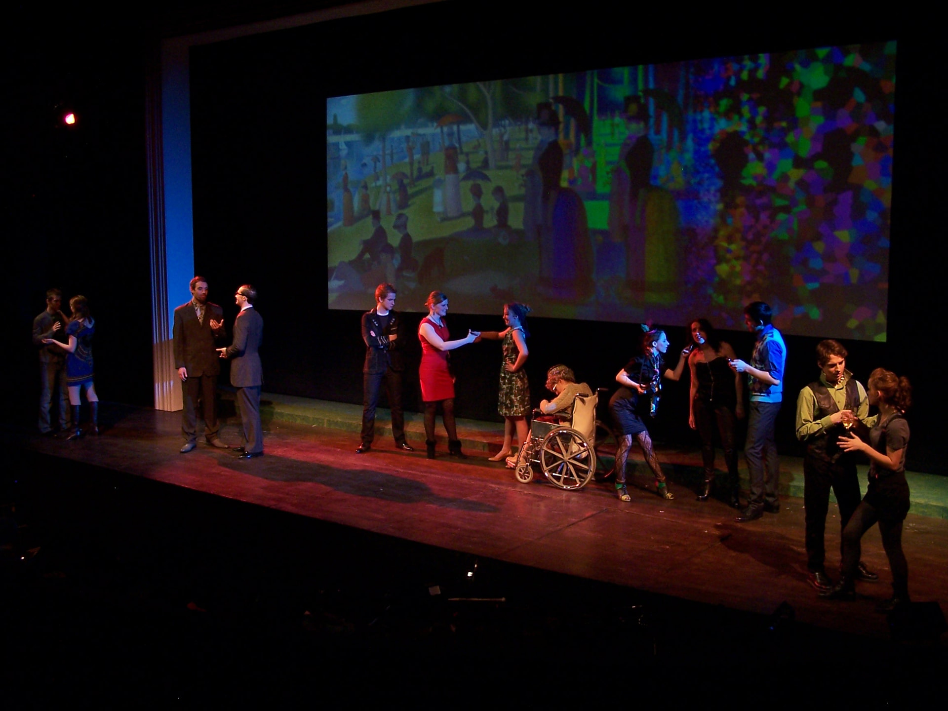 Sunday In The Park With George — the Act Two gallery party under the fragmenting projection