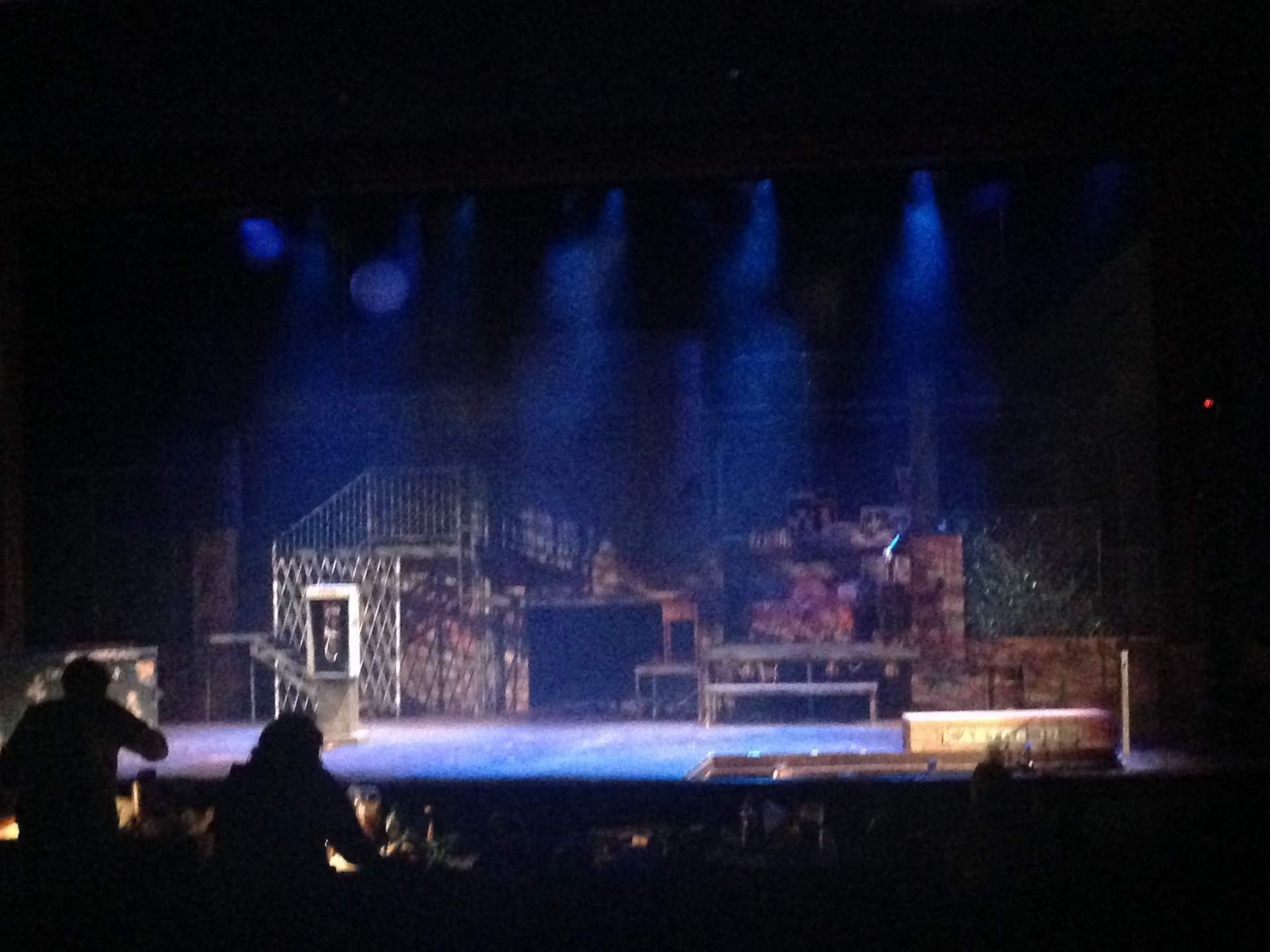 RENT at Montgomery College — the scaffold and street set under a blue wash during tech